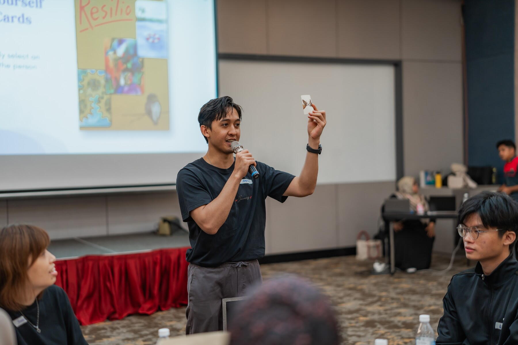 AZEO facilitator presenting to participants during a training session
