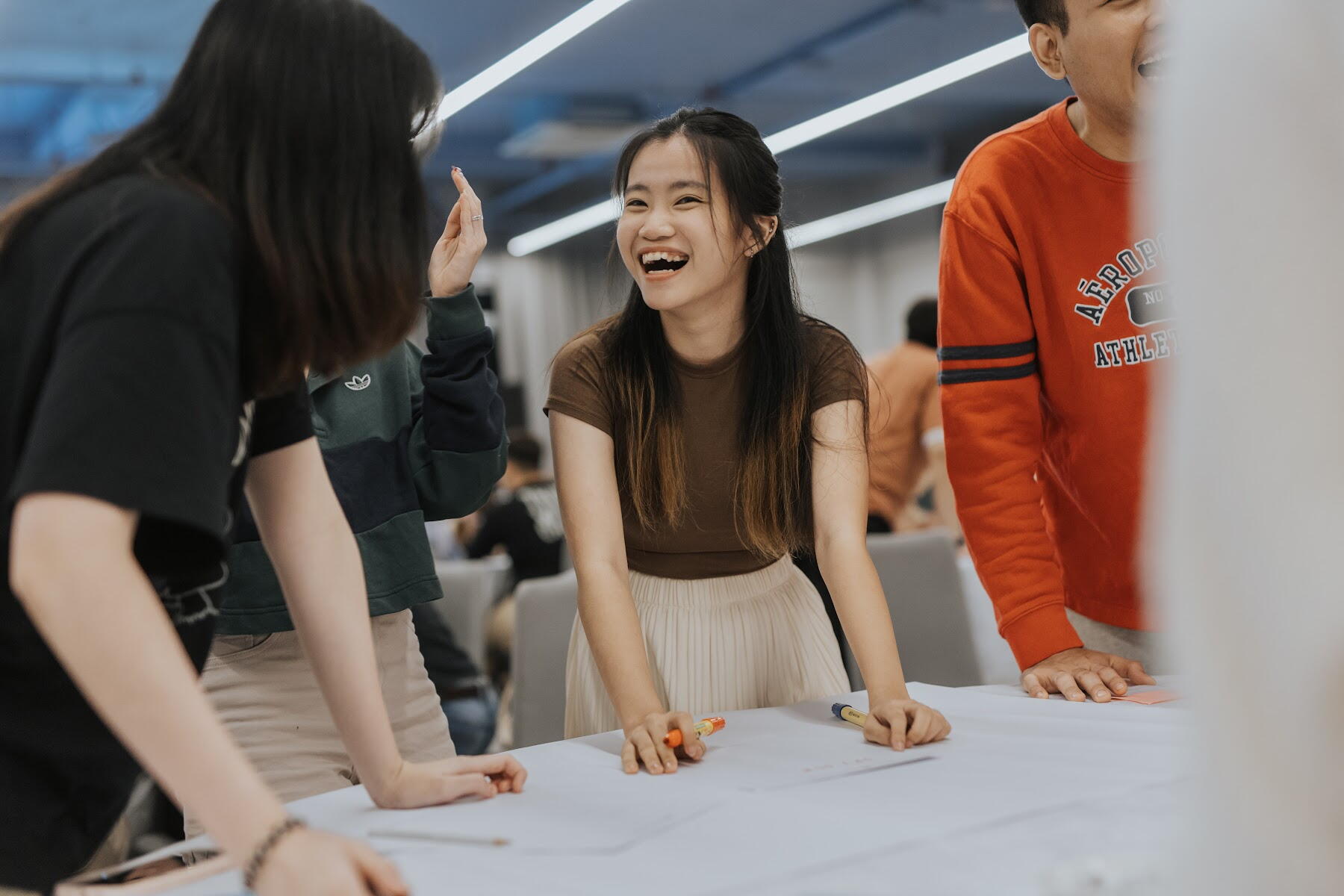 Participant smiling during a group activity at a training session